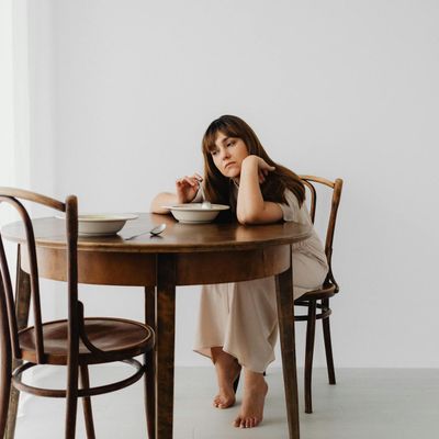 A simple dumbbell resting on the floor.